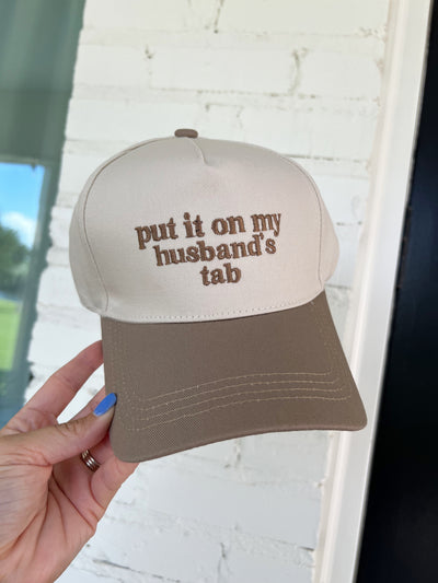 Put It On My Husband's Tab Trucker Hat