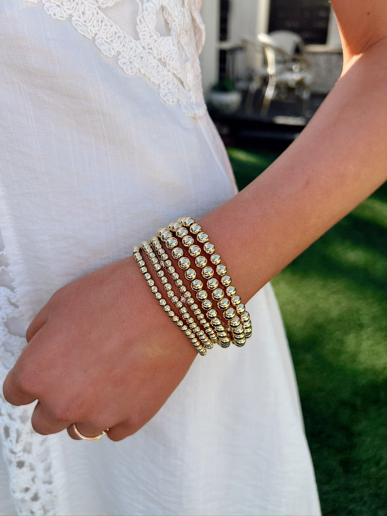 6 Piece Assorted Gold Bead Stretch Bracelet Set