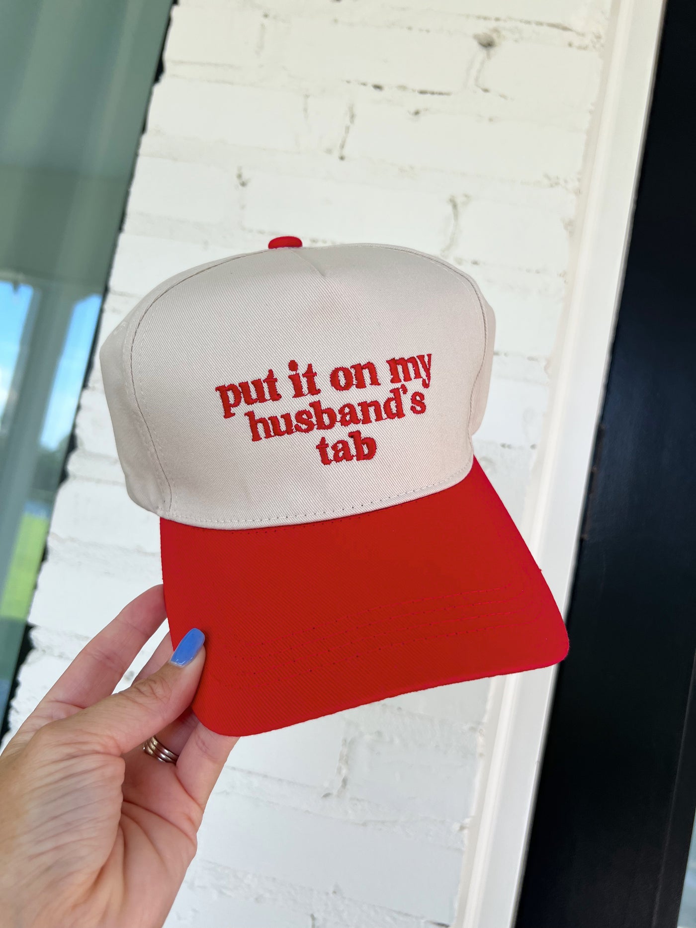 Put It On My Husband's Tab Trucker Hat